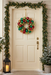 14-inch multi-colour glitter wreath hanging on a door on a festive Christmas porch