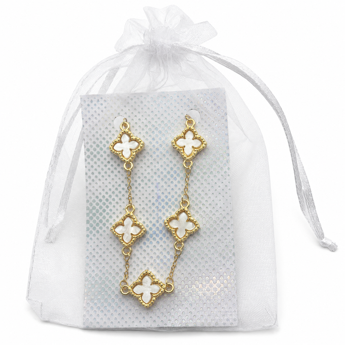 Gold-tone five-cross bracelet with white pearl-look inlays displayed on a card inside a white organza gift pouch.