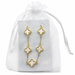 Gold-tone five-cross bracelet with white pearl-look inlays displayed on a card inside a white organza gift pouch.