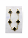 Gold-tone bracelet with five black enamel-look crosses displayed on a silver-patterned card inside a white organza gift pouch.