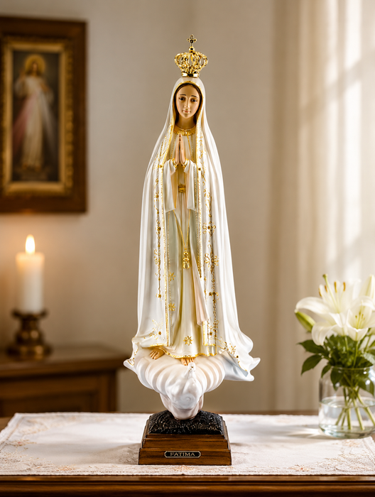 12-inch Our Lady of Fatima statue in ivory resin with finely sculpted robes and serene expression, depicted standing in prayer on a simple base with traditional Marian detailing.