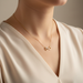 Infinity Cross Necklace worn - delicate