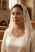Latina woman wearing an ivory chapel veil and the Miraculous Medal necklace