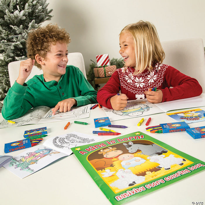 Two children colouring Nativity story activity pages at a Christmas table with the A King Is Born colouring book