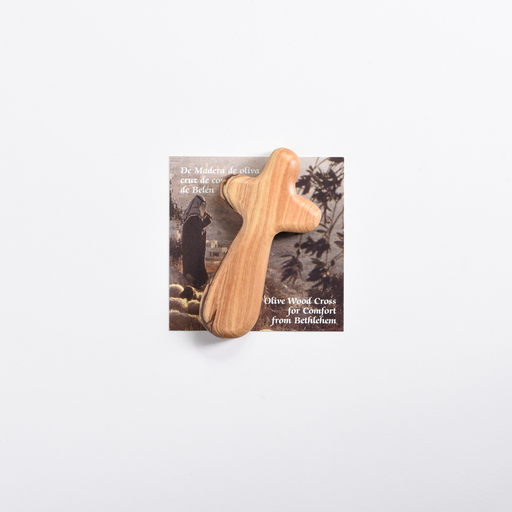 Rounded olive wood comfort cross with natural wood grain on its Bethlehem presentation card.