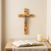 Olive wood wall crucifix in a softly lit home prayer corner